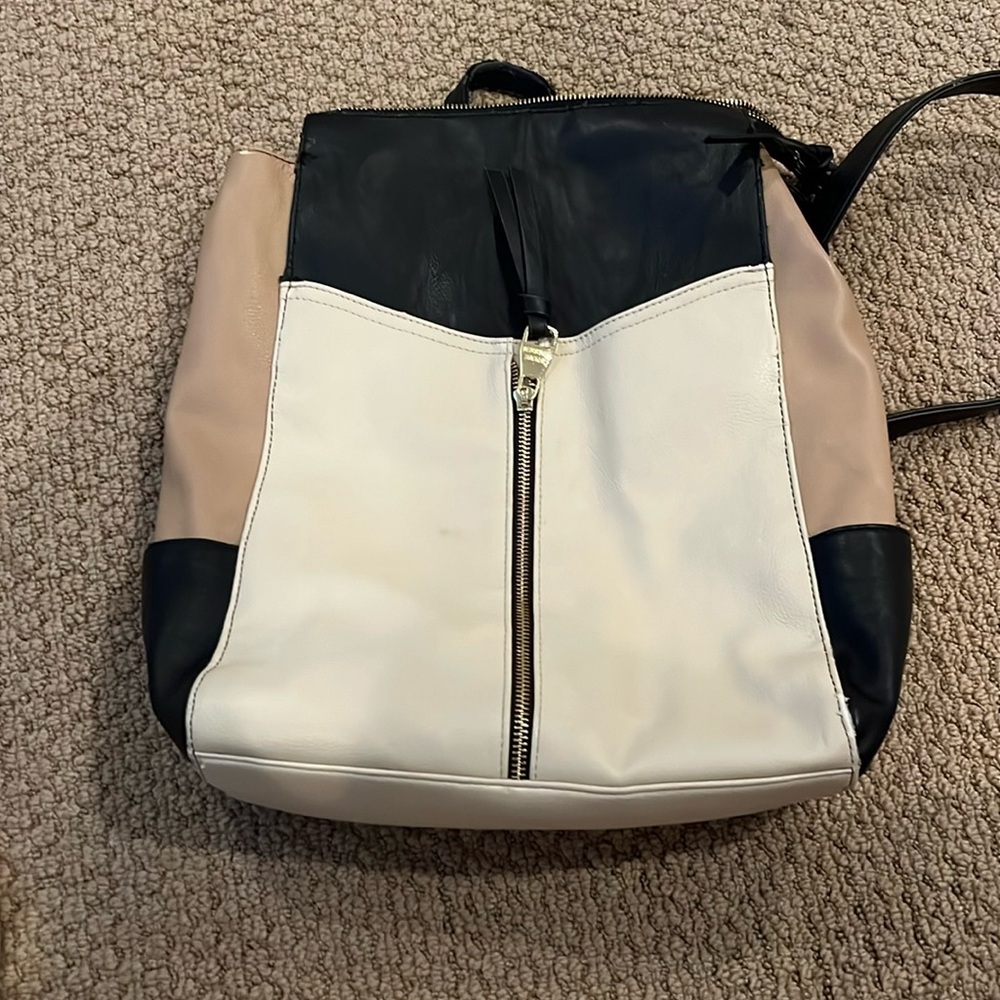 Steve Madden backpack with zipper top. Tan/cream/black. Adjustable straps.